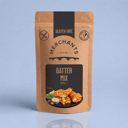 A stand-up kraft paper pouch of Merchant's Batter Mix, 250g, featuring a black and brown label with a food photo of battered fish and chips, set against a light blue background.