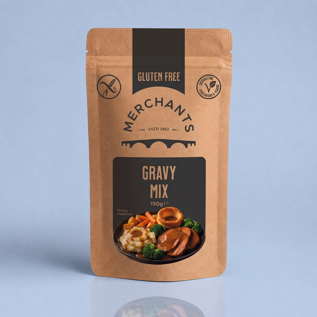 A stand-up pouch of Merchants Gravy Mix, 150g, featuring a kraft brown packaging design with black panels and a food illustration of roasted meat, mashed potatoes, and broccoli.