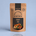 A stand-up pouch of Merchants Gravy Mix, 150g, featuring a kraft brown packaging design with black panels and a food illustration of roasted meat, mashed potatoes, and broccoli.