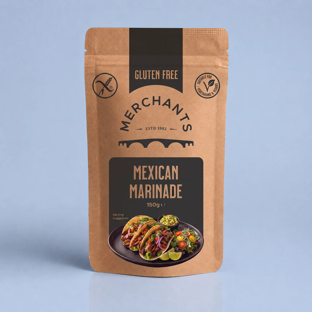 A stand-up pouch of Merchants Gluten Free Mexican Marinade, 150g, featuring a kraft brown packaging design with black panels and a food photo of tacos on the front, set against a light blue background.