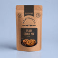 A stand-up kraft paper pouch of Merchants Plain Cookie Mix, 250g, featuring a black central label with cookie imagery, set against a light blue background.