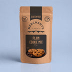 A stand-up kraft paper pouch of Merchants Plain Cookie Mix, 250g, featuring a black central label with cookie imagery, set against a light blue background.