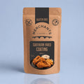 A stand-up kraft paper pouch of Merchants Southern Fried Coating, 250g, featuring a black and brown label with a photo of fried chicken and fries, set against a light blue background.